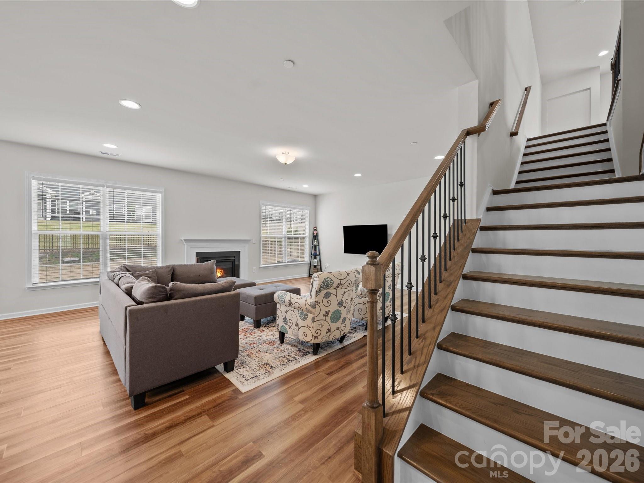9582 Creighton Road Northwest Concord, NC 28027 - Photo 17 of 43 a living room with furniture and wooden floor
