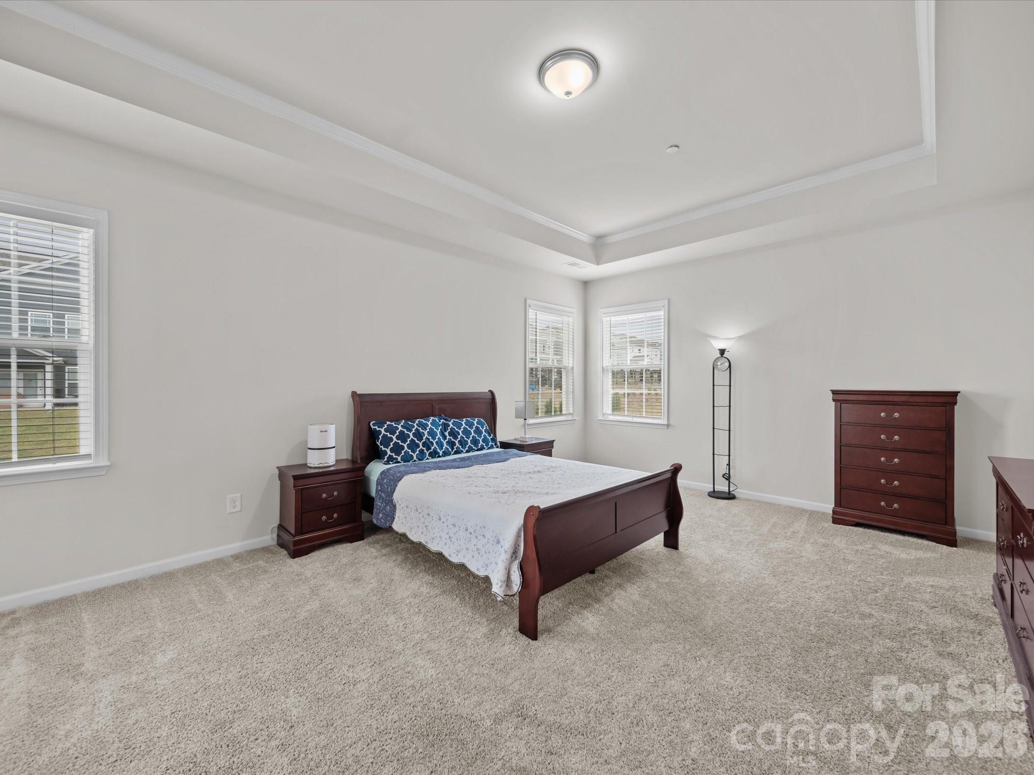 9582 Creighton Road Northwest Concord, NC 28027 - Photo 18 of 43 a spacious bedroom with a bed and a cabinets