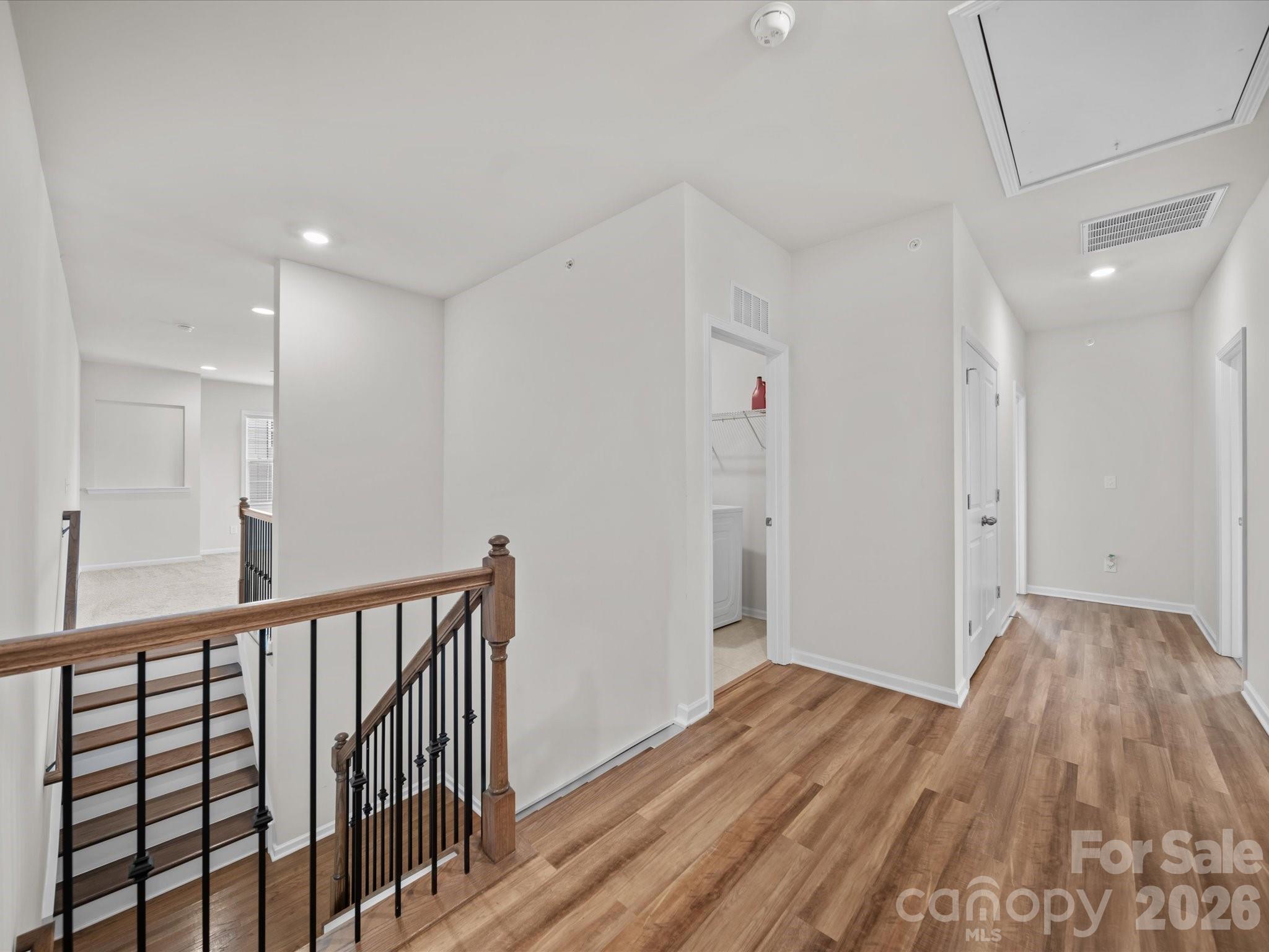 9582 Creighton Road Northwest Concord, NC 28027 - Photo 23 of 43 a view of a hallway with wooden floor