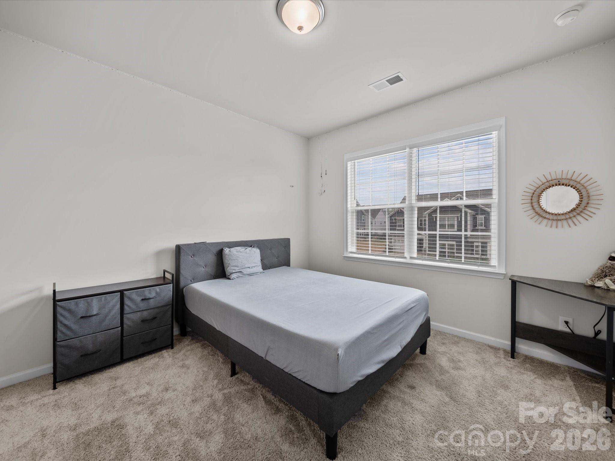 9582 Creighton Road Northwest Concord, NC 28027 - Photo 29 of 43 a spacious bedroom with a bed and a window