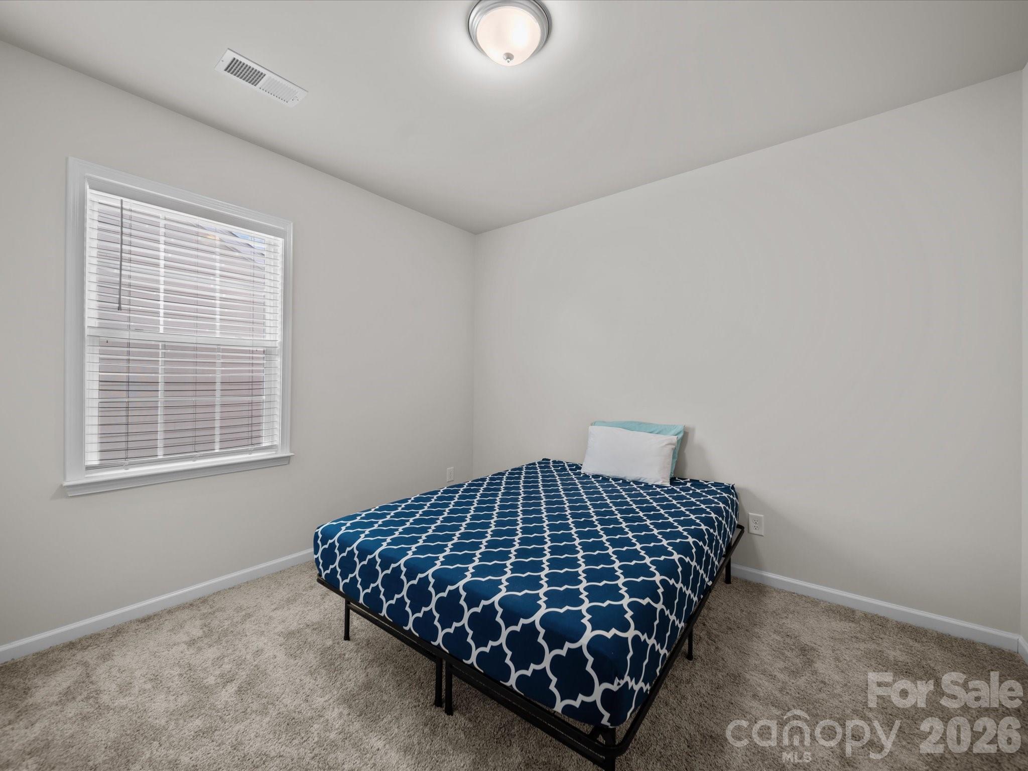 9582 Creighton Road Northwest Concord, NC 28027 - Photo 30 of 43 a bedroom with a bed and window