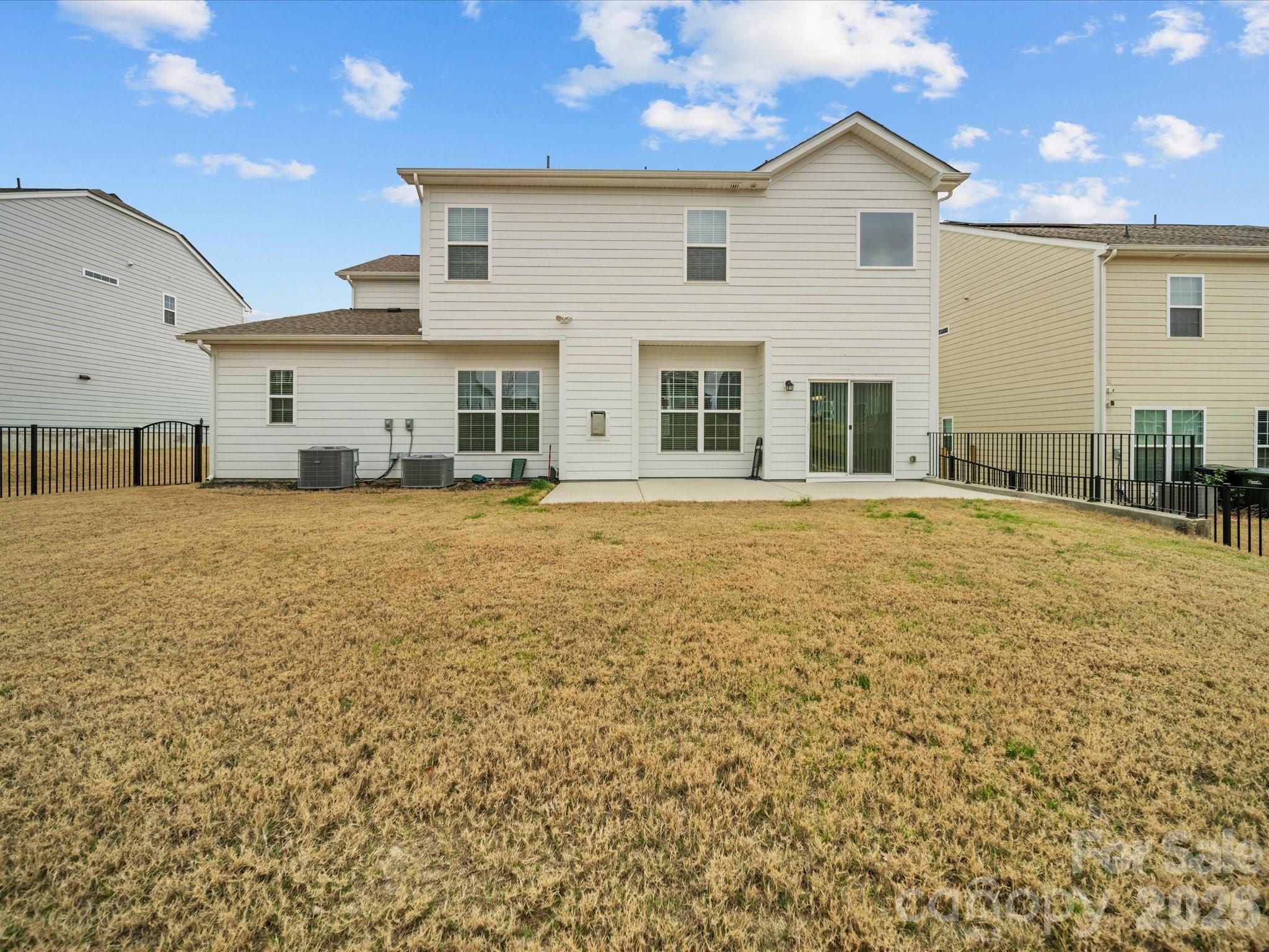 9582 Creighton Road Northwest Concord, NC 28027 - Photo 34 of 43 a view of a house with a yard