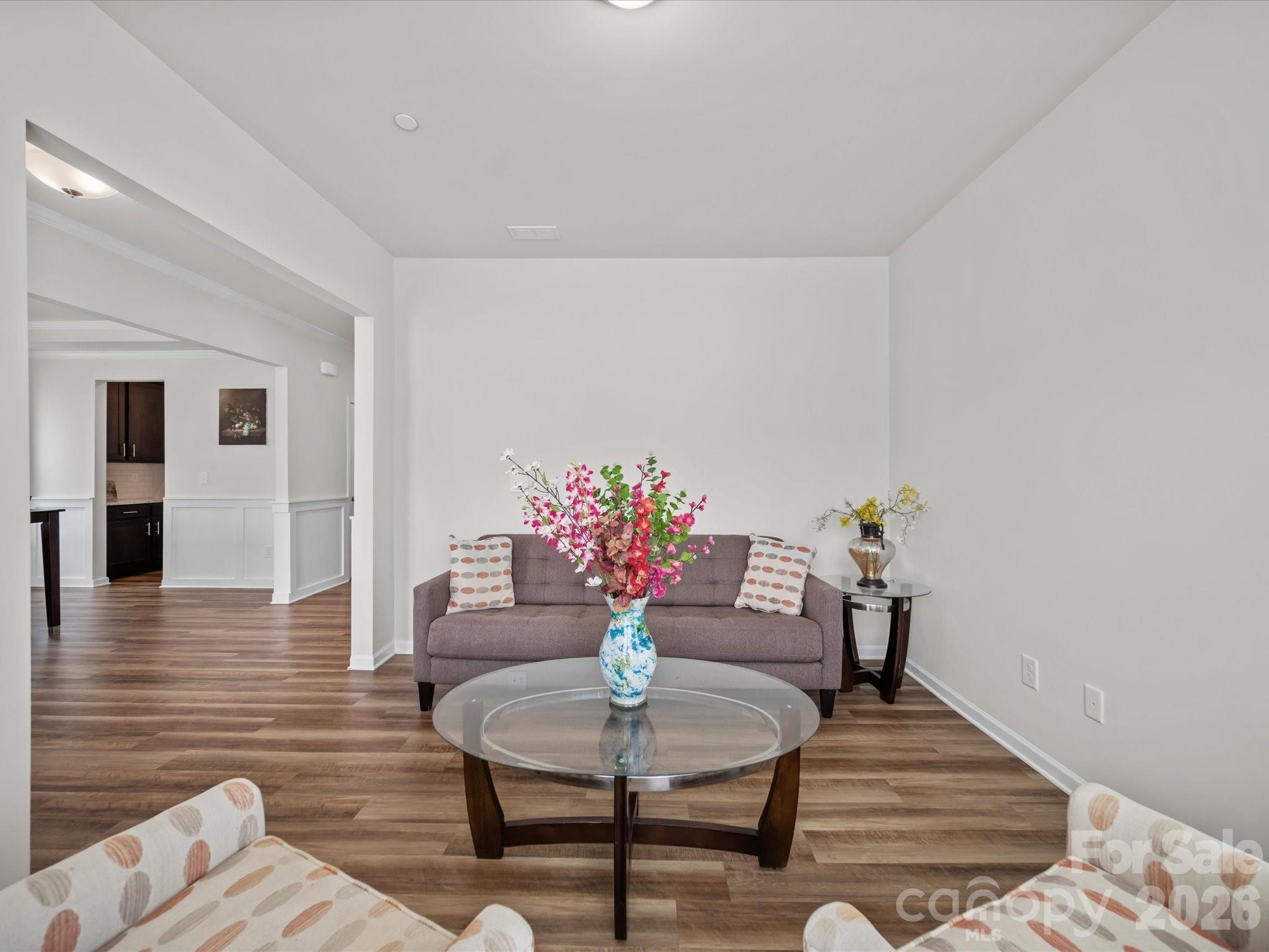 9582 Creighton Road Northwest Concord, NC 28027 - Photo 4 of 43 a living room with furniture and a potted plant