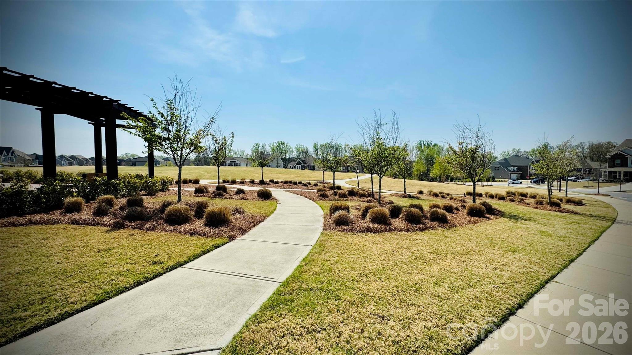 9582 Creighton Road Northwest Concord, NC 28027 - Photo 43 of 43 a view of a swimming pool with outdoor seating and plants