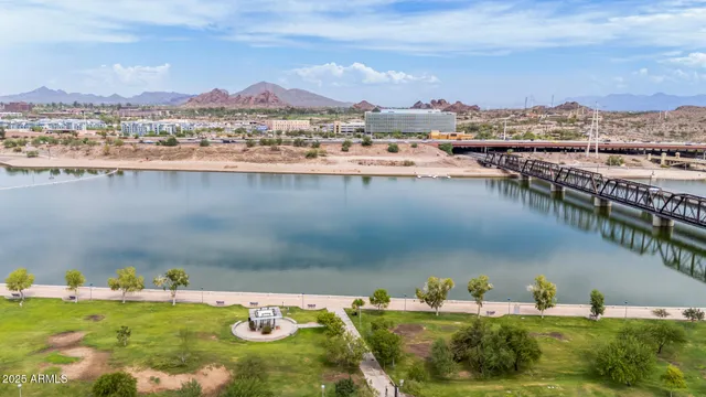 a swimming pool with outdoor seating and yard