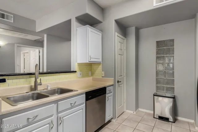 a view of kitchen with furniture and refrigerator