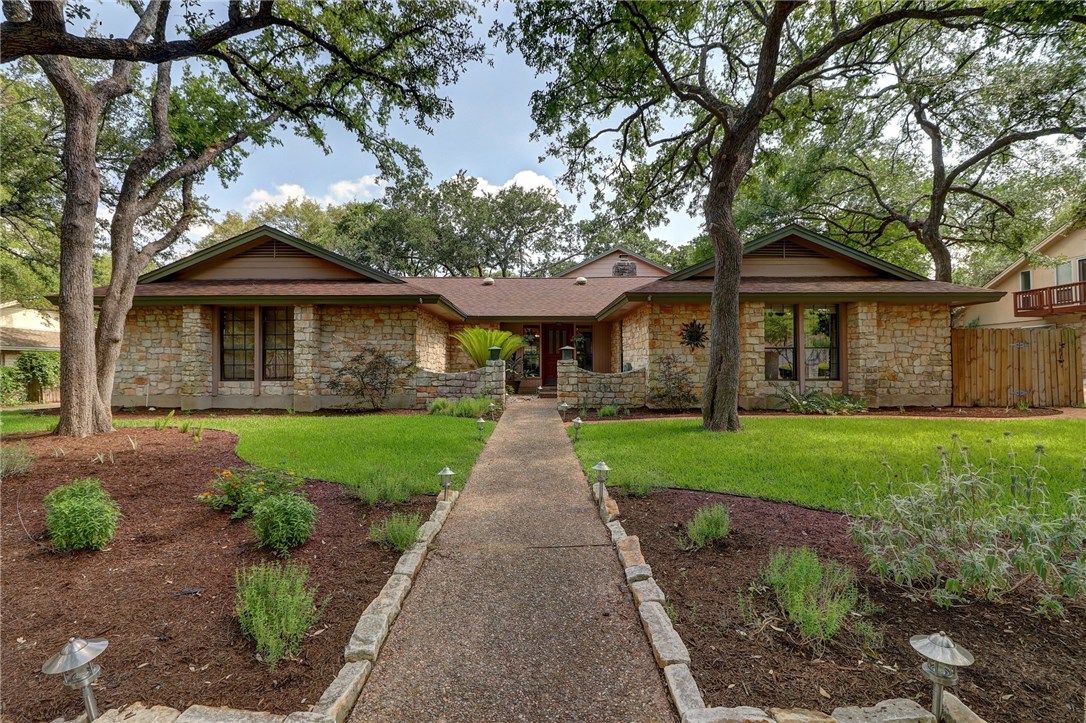 9901 Richelieu Road Austin, TX 78750 - Photo 1 of 1 a front view of a house with a yard