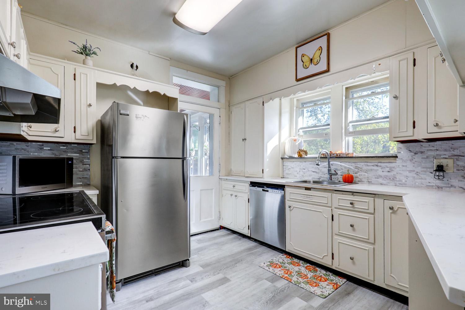 483 Angora Road Reading, PA 19606 - Photo 18 of 73 a kitchen with appliances a sink cabinets and a window