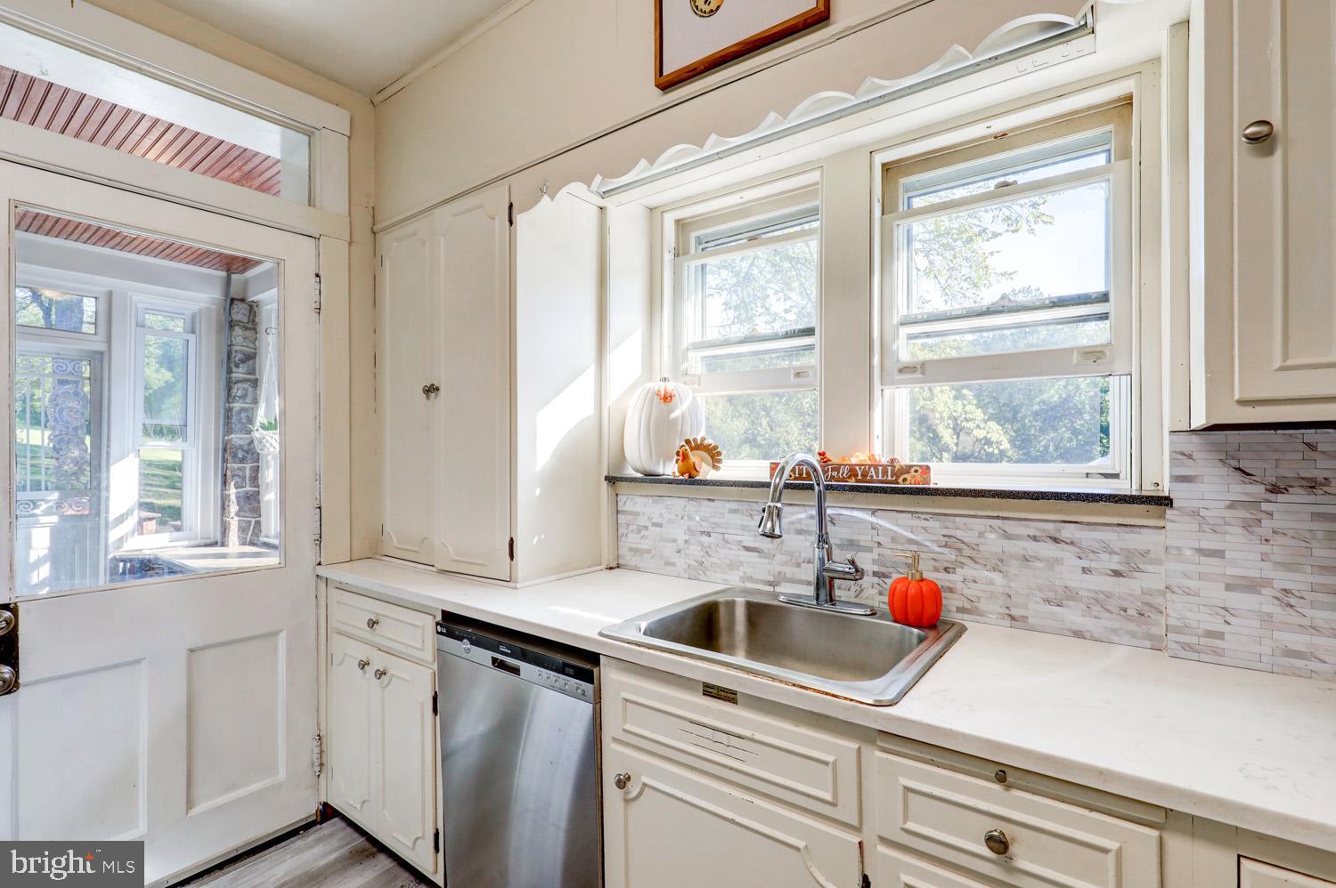 483 Angora Road Reading, PA 19606 - Photo 20 of 73 a kitchen with stainless steel appliances a sink a window and cabinets
