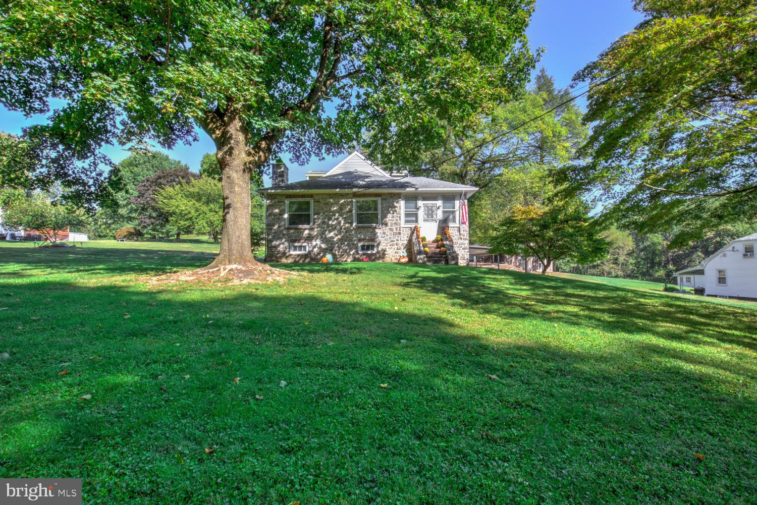 483 Angora Road Reading, PA 19606 - Photo 2 of 73 a front view of a house with garden