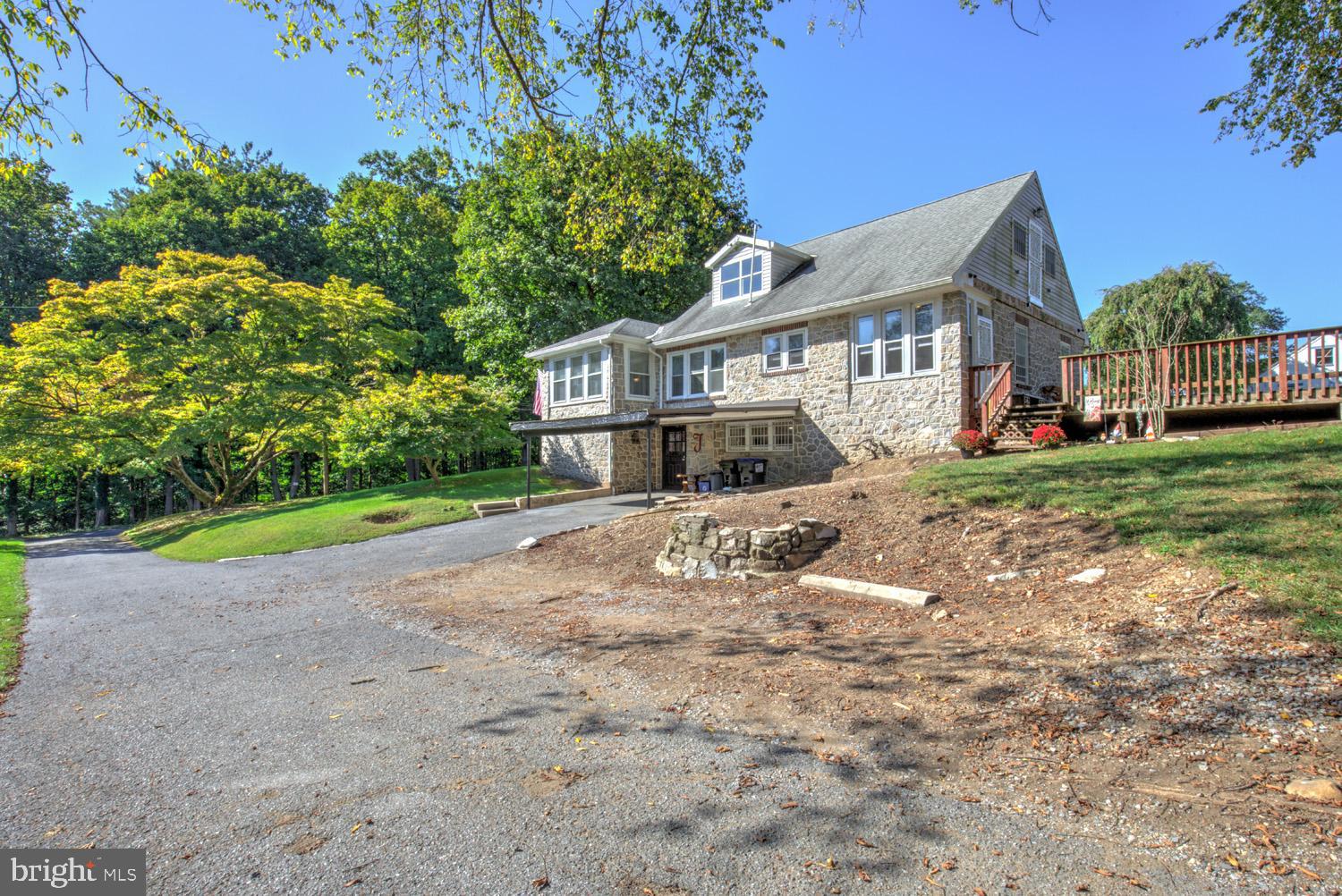 483 Angora Road Reading, PA 19606 - Photo 6 of 73 a house that has a tree in front of it