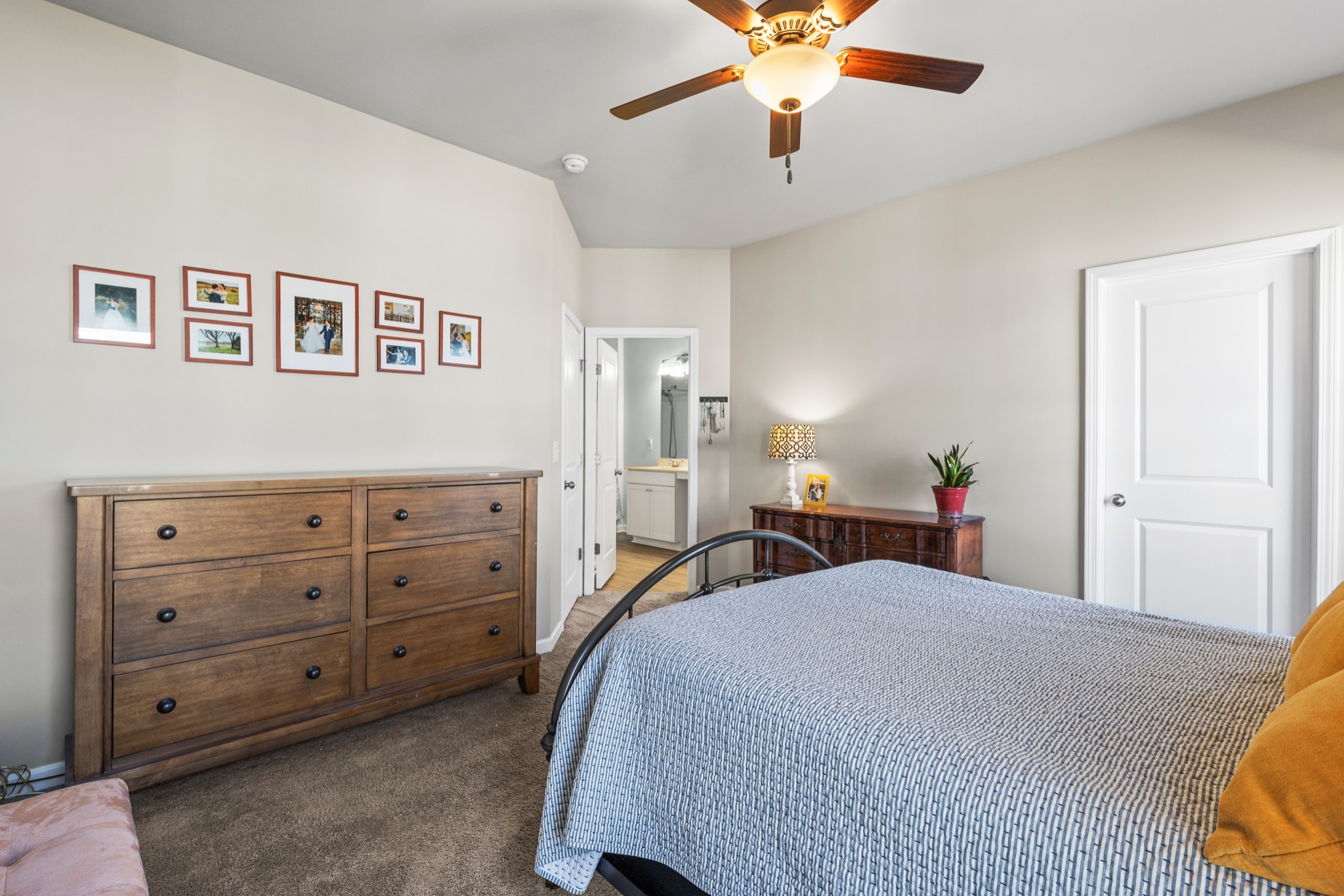 2806 Dixie Road Columbia, TN 38401 - Photo 18 of 28 a bedroom with a bed and a chandelier