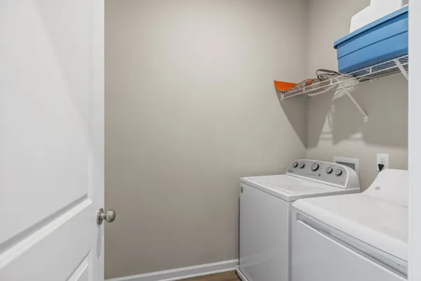 a view of a house with backyard and chairs