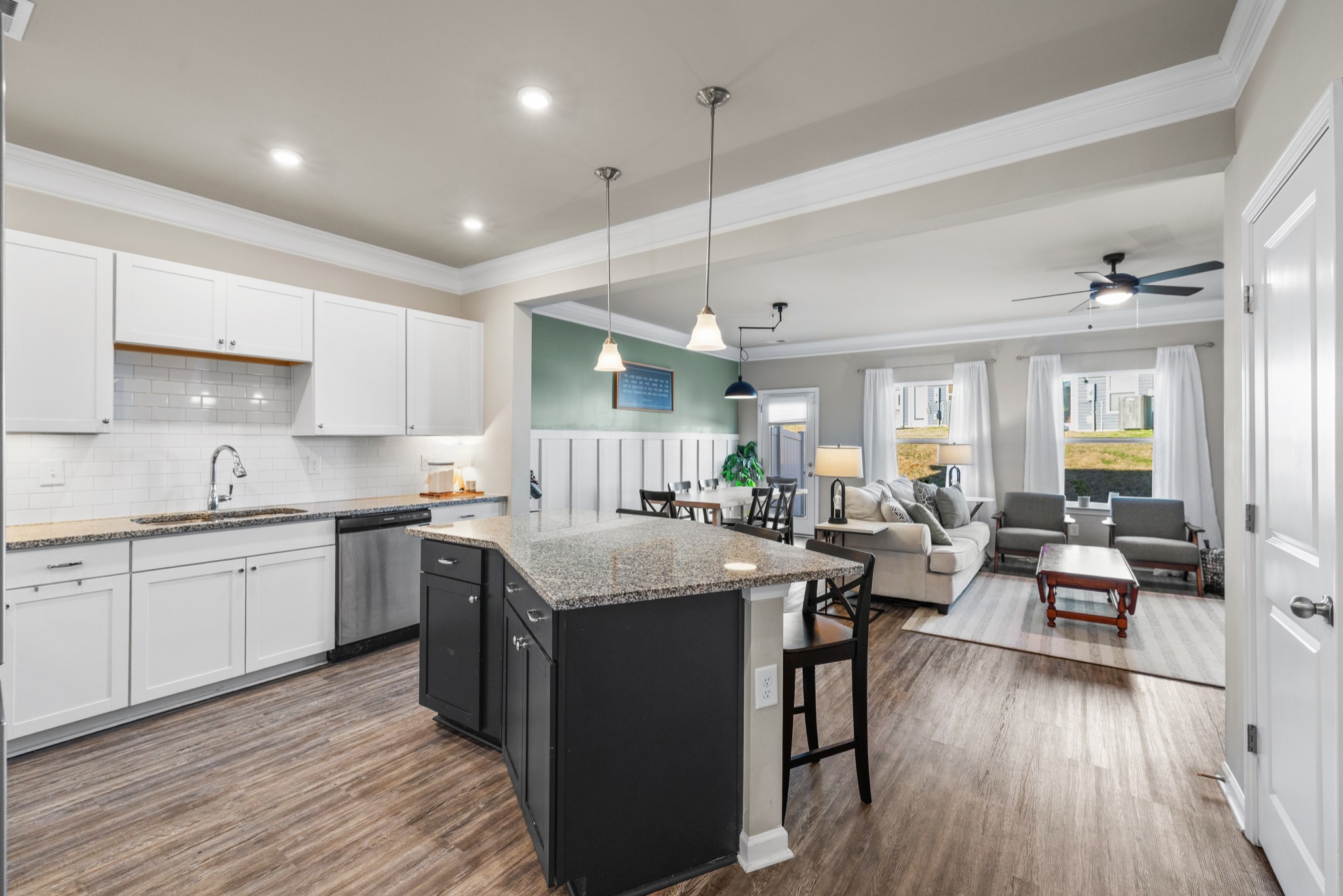 2806 Dixie Road Columbia, TN 38401 - Photo 7 of 28 a large kitchen with cabinets a sink dishwasher a dining table chairs and wooden floor