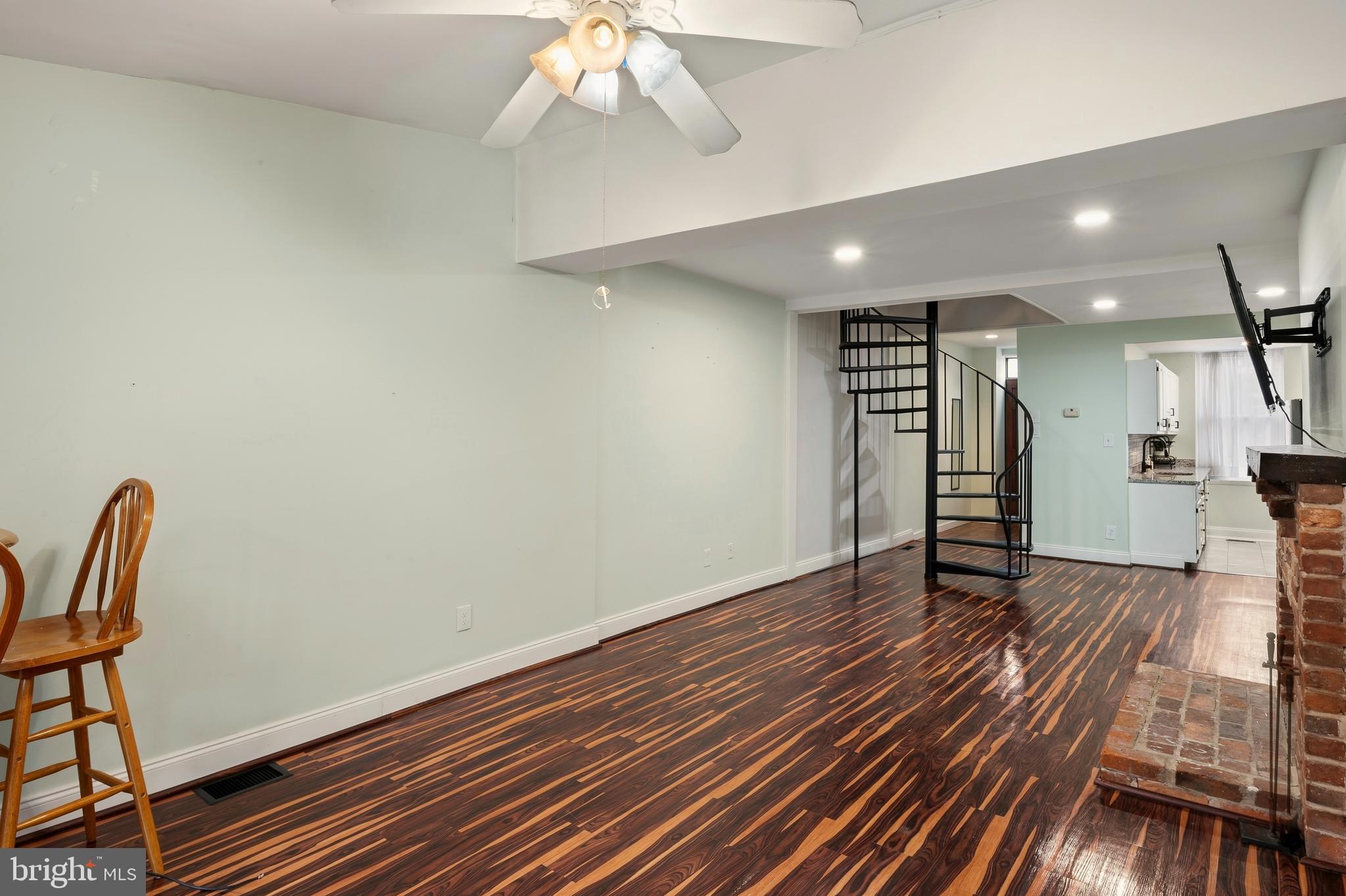 636 Portland Street Baltimore, MD 21230 - Photo 5 of 20 a view of an empty room with wooden floor