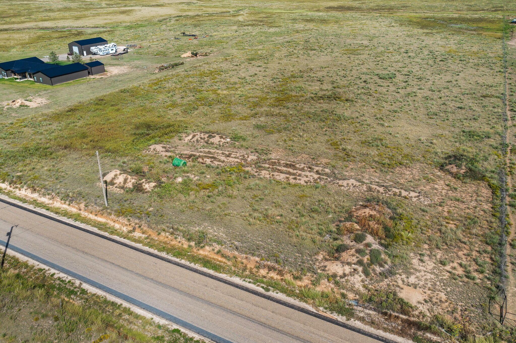 3300 West Cemetery Road Canyon, TX 79015 - Photo 13 of 15 a view of a floor to ceiling window and a yard
