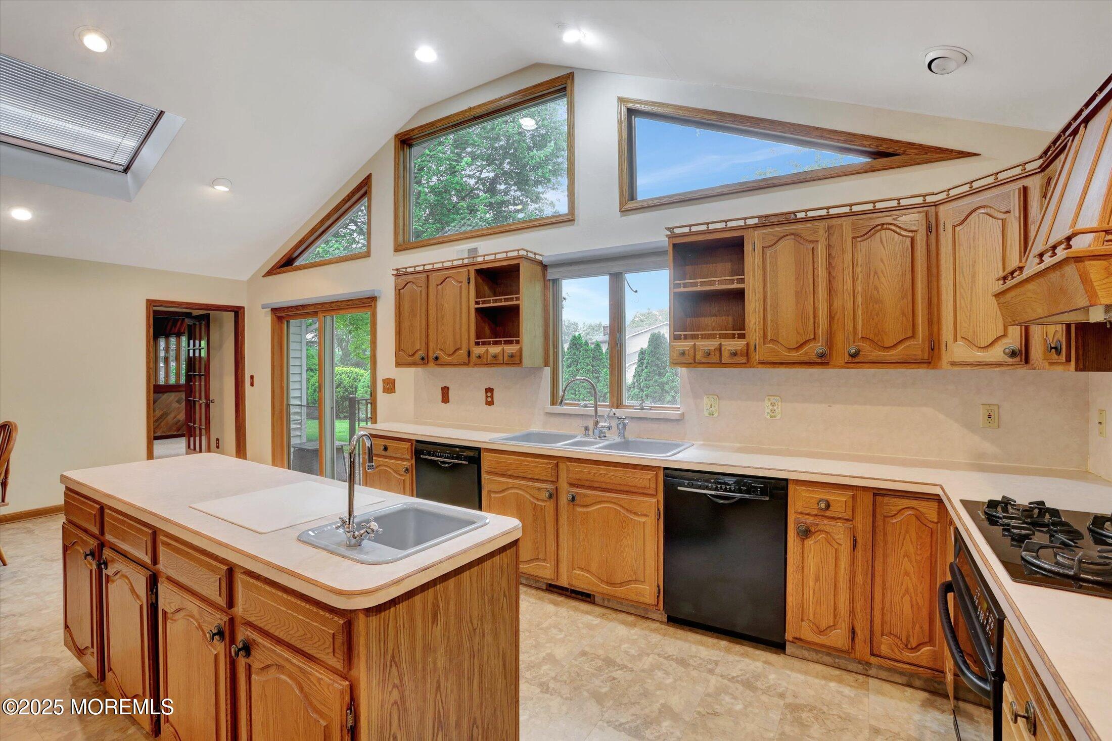 159 Koster Drive Freehold, NJ 07728 - Photo 12 of 37 a kitchen with a sink stove and cabinets