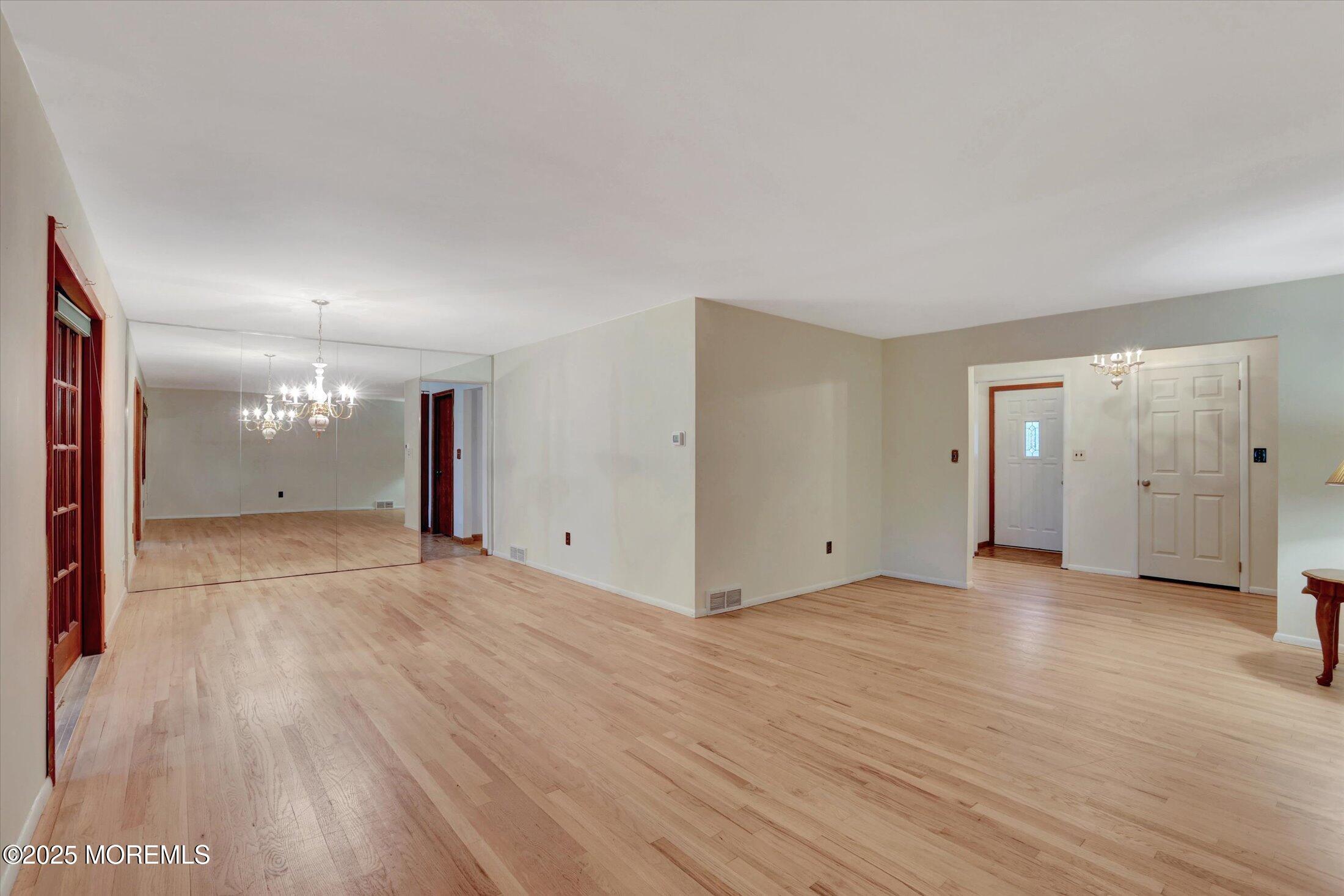 159 Koster Drive Freehold, NJ 07728 - Photo 15 of 37 a view of an empty room with wooden floor and closet