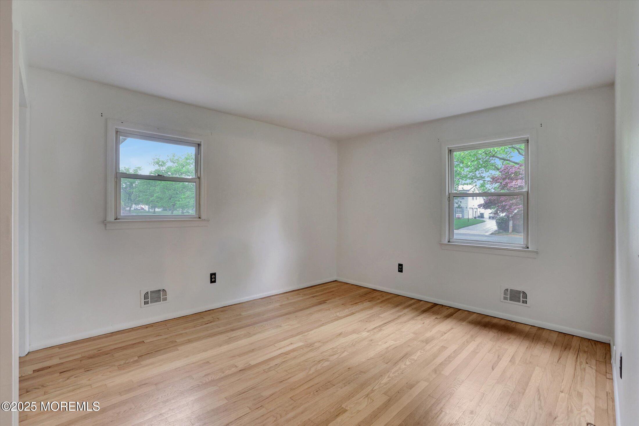 159 Koster Drive Freehold, NJ 07728 - Photo 20 of 37 a view of room with window and wooden floor