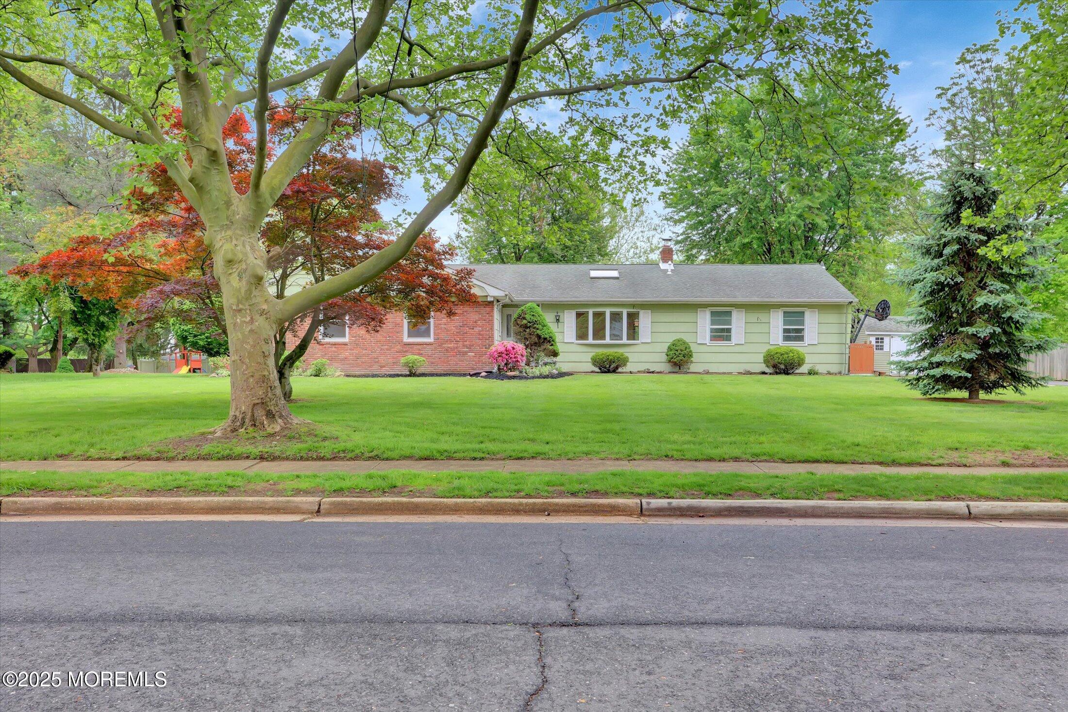 159 Koster Drive Freehold, NJ 07728 - Photo 2 of 37 a front view of house with yard and green space