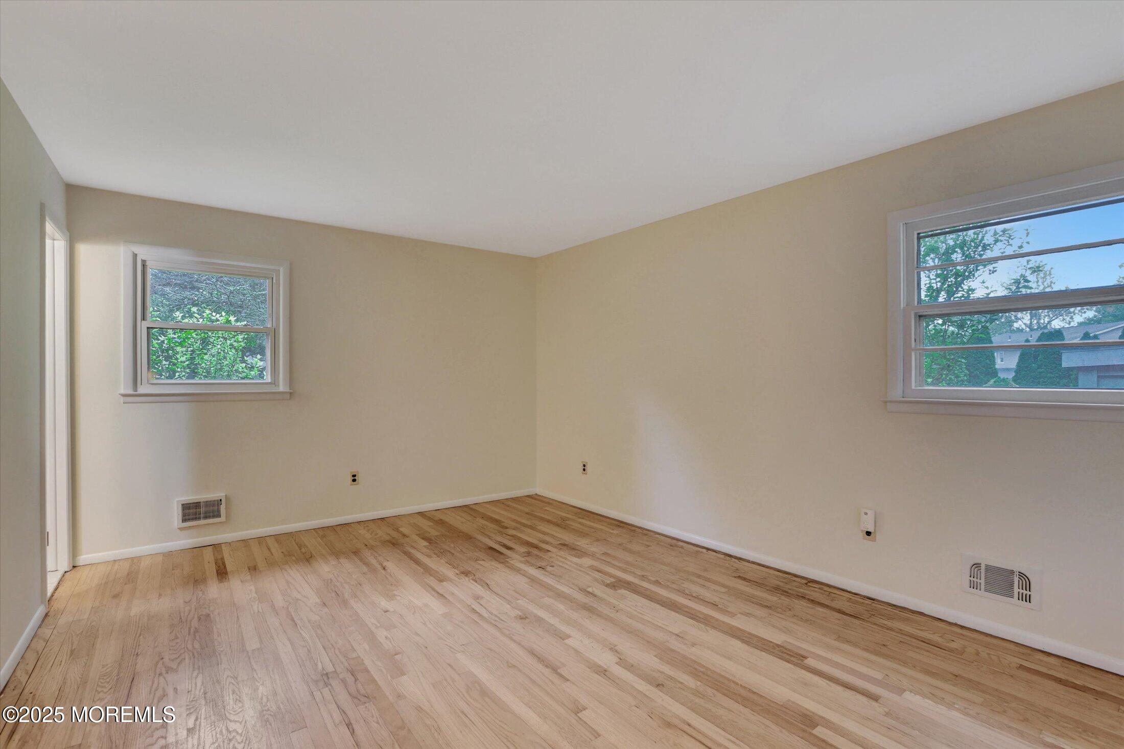 159 Koster Drive Freehold, NJ 07728 - Photo 24 of 37 a view of a room with wooden floor and window