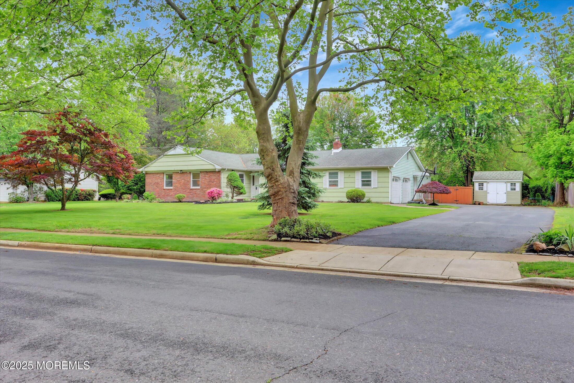 159 Koster Drive Freehold, NJ 07728 - Photo 3 of 37 a front view of house with yard and green space