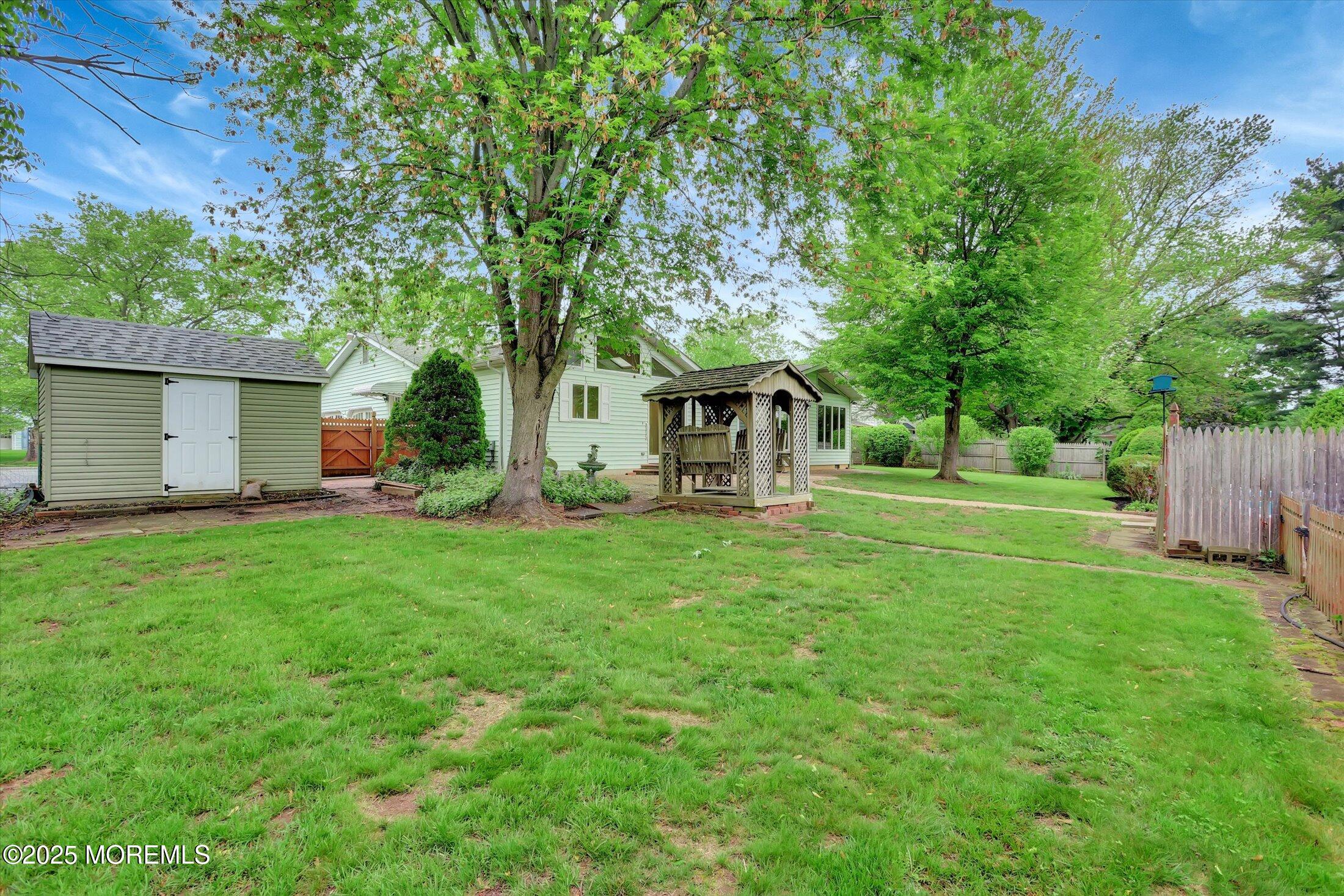 159 Koster Drive Freehold, NJ 07728 - Photo 32 of 37 a front view of house with yard and green space