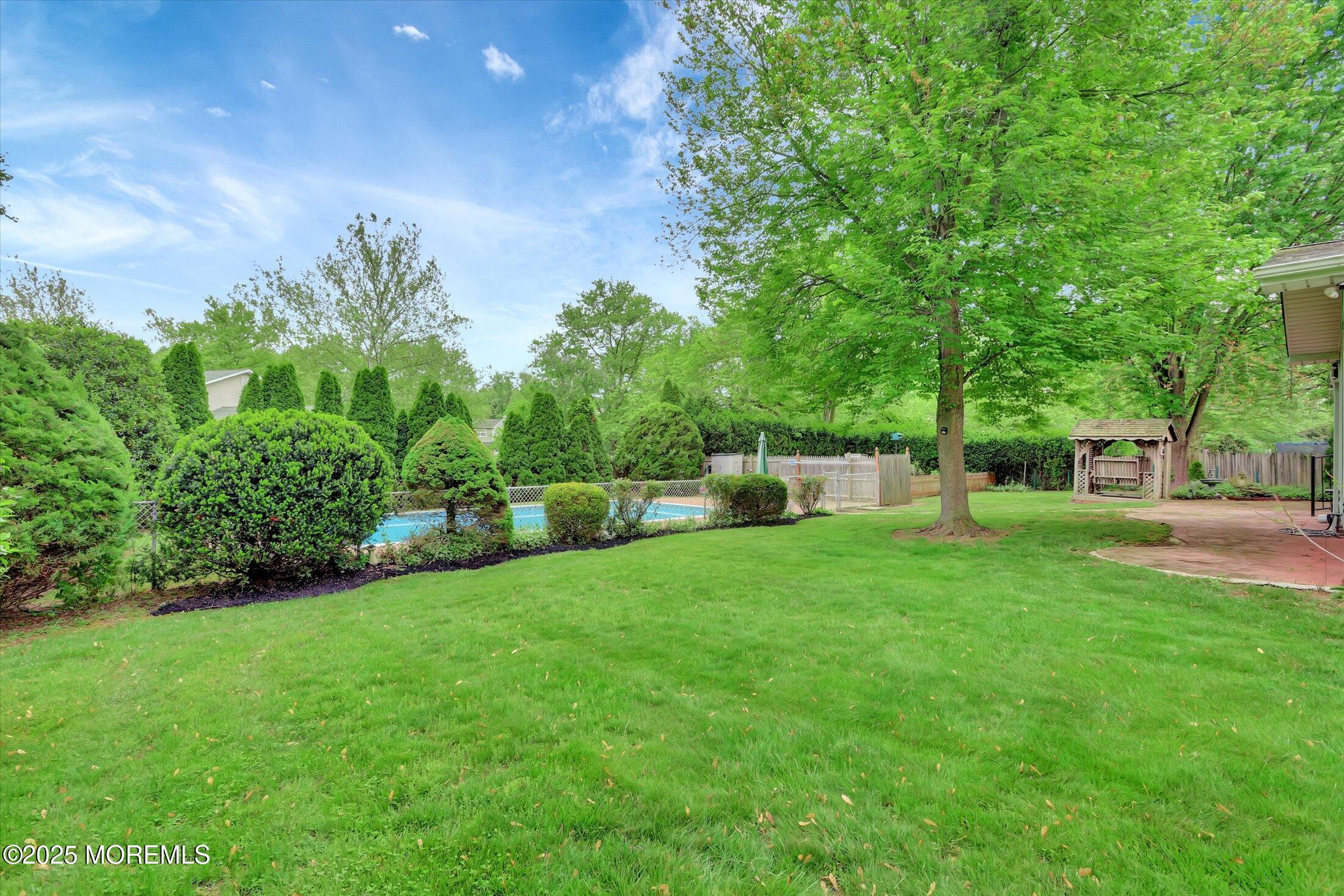 159 Koster Drive Freehold, NJ 07728 - Photo 34 of 37 a view of a backyard with sitting area