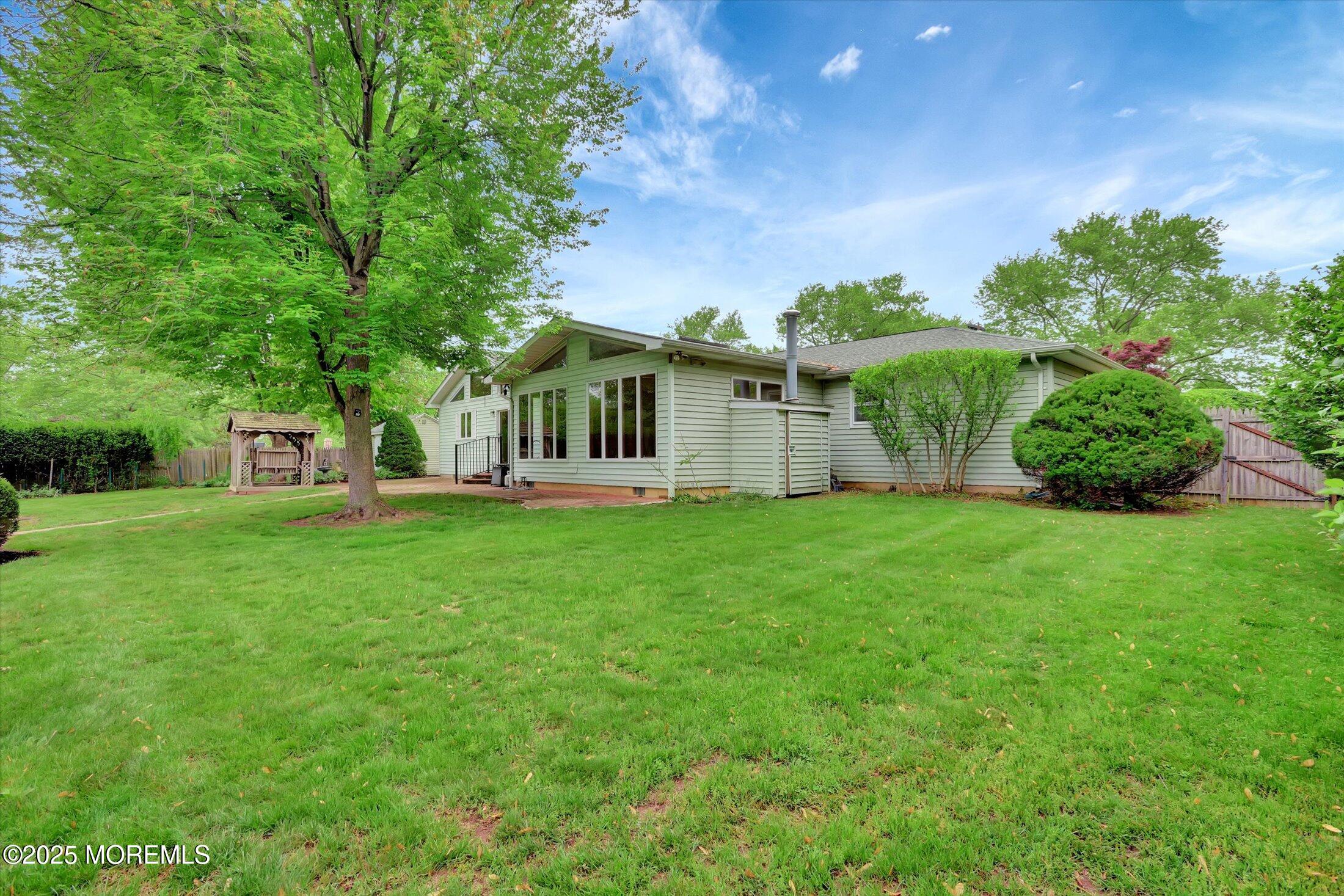 159 Koster Drive Freehold, NJ 07728 - Photo 35 of 37 a view of house with backyard space and garden