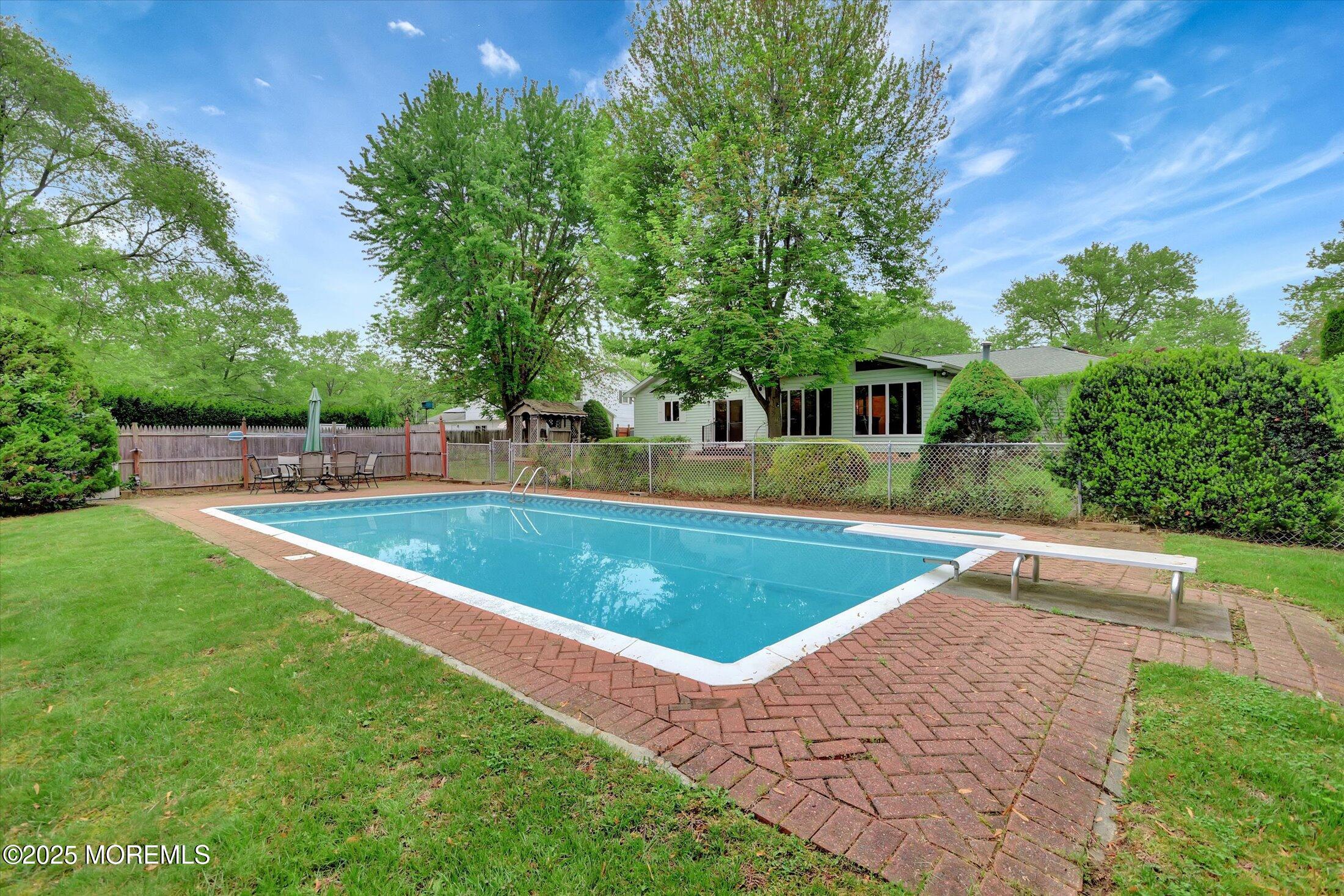 159 Koster Drive Freehold, NJ 07728 - Photo 37 of 37 a view of a backyard with swimming pool