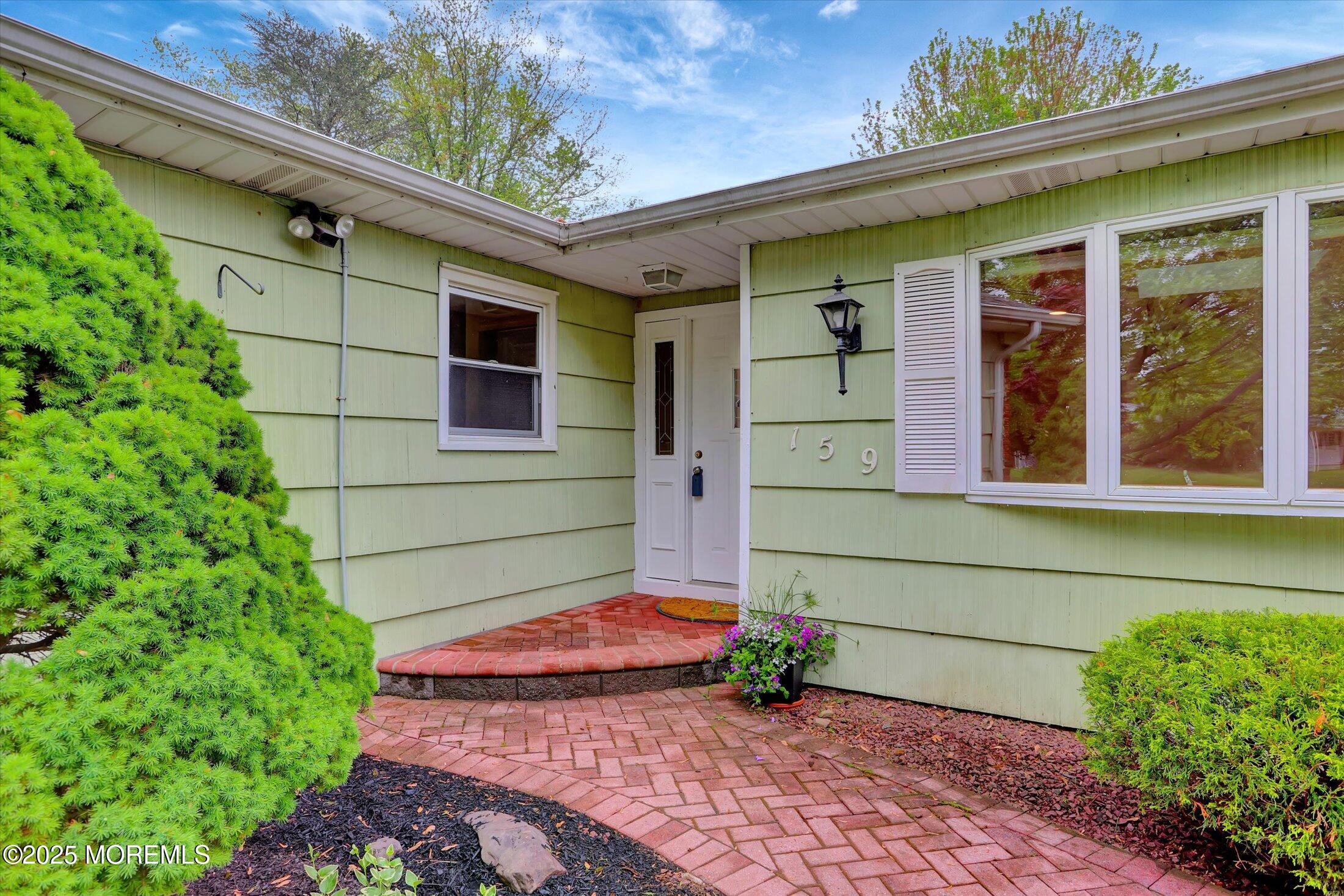 159 Koster Drive Freehold, NJ 07728 - Photo 5 of 37 a front view of a house with a yard