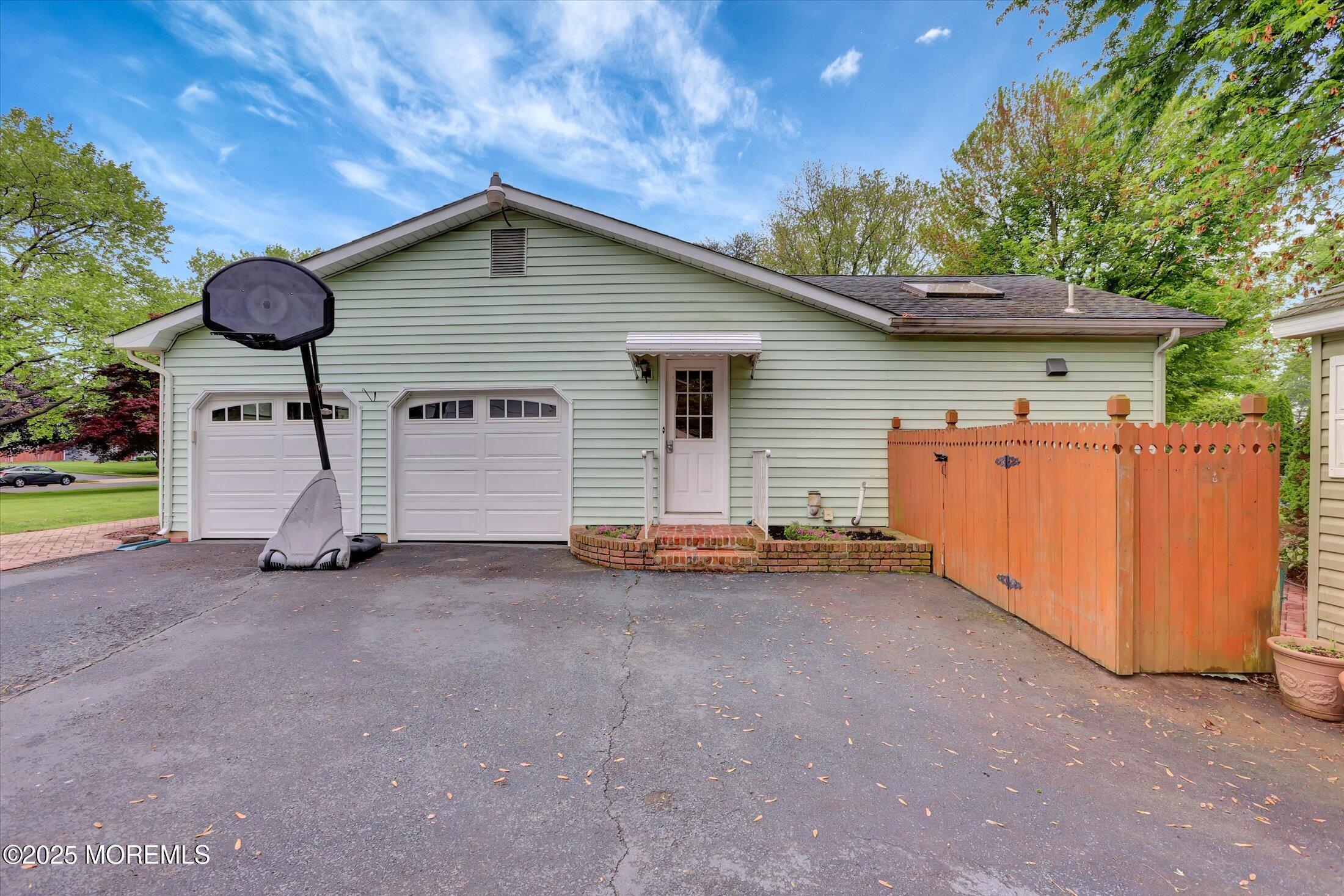 159 Koster Drive Freehold, NJ 07728 - Photo 6 of 37 a view of a house with backyard and trees