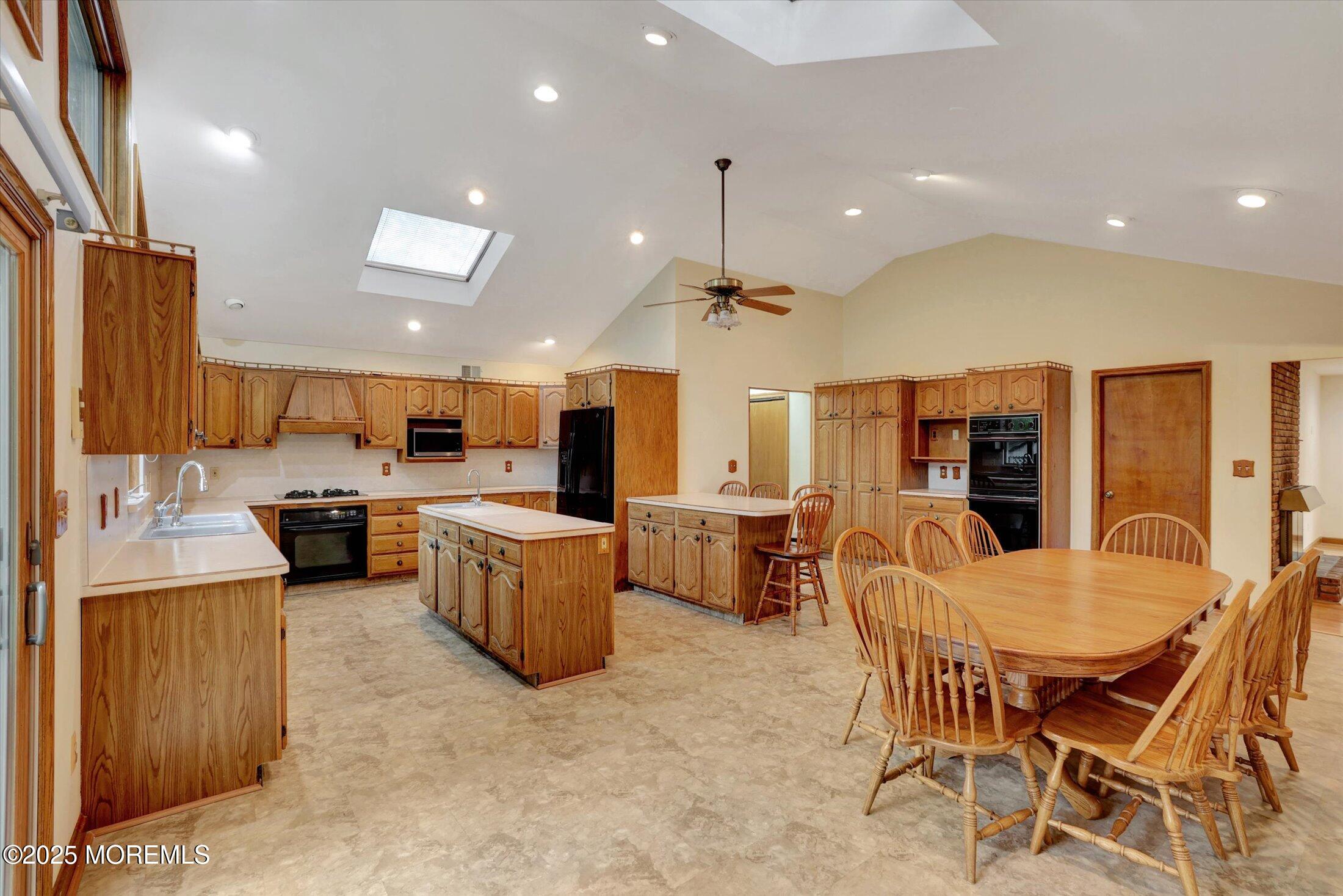 159 Koster Drive Freehold, NJ 07728 - Photo 10 of 37 a kitchen with a table and chairs in it