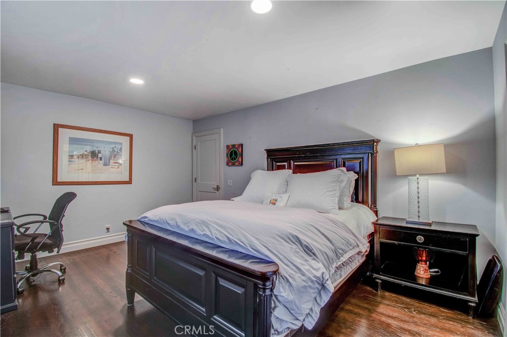 255 Emerald Bay Laguna Beach, CA 92651 - Photo 12 of 27 a bedroom with a bed and a tv on table