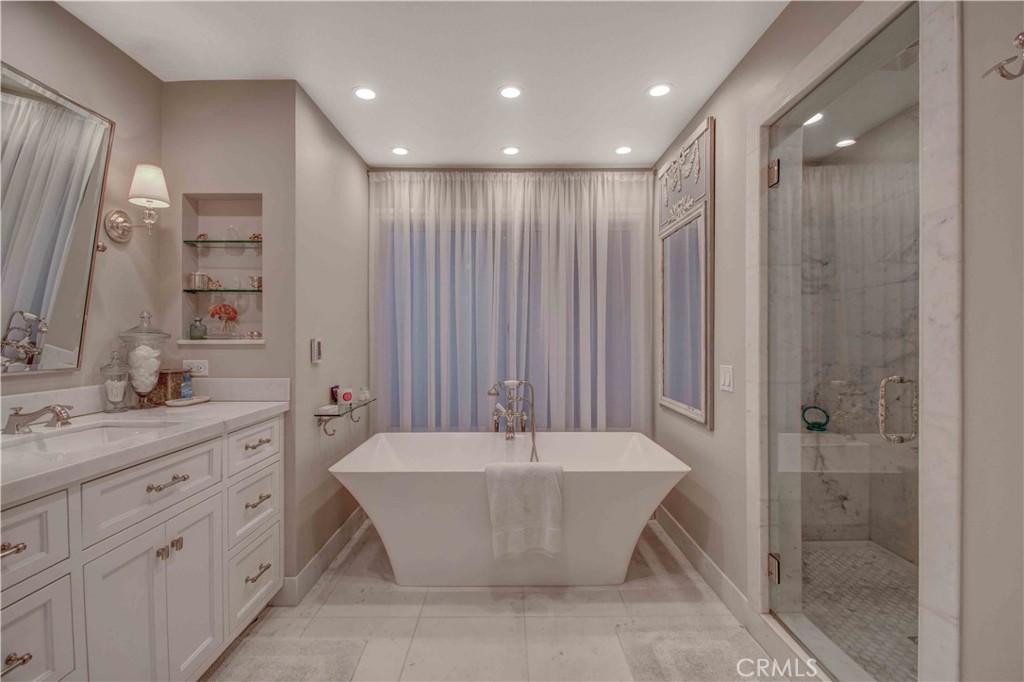 255 Emerald Bay Laguna Beach, CA 92651 - Photo 14 of 27 a spacious bathroom with a large tub shower and sink