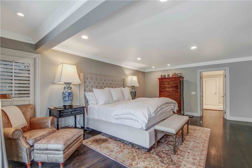 255 Emerald Bay Laguna Beach, CA 92651 - Photo 15 of 27 a bedroom with a bed and wooden floor