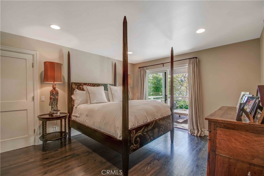 255 Emerald Bay Laguna Beach, CA 92651 - Photo 18 of 27 a bedroom with a bed and a window