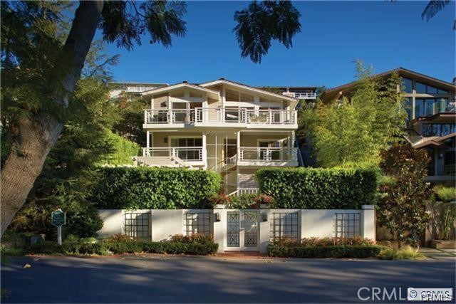 255 Emerald Bay Laguna Beach, CA 92651 - Photo 26 of 27 a front view of a house with a yard