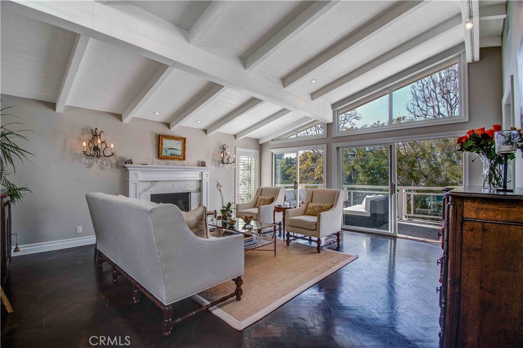 255 Emerald Bay Laguna Beach, CA 92651 - Photo 8 of 27 a living room with furniture a large window and wooden floor