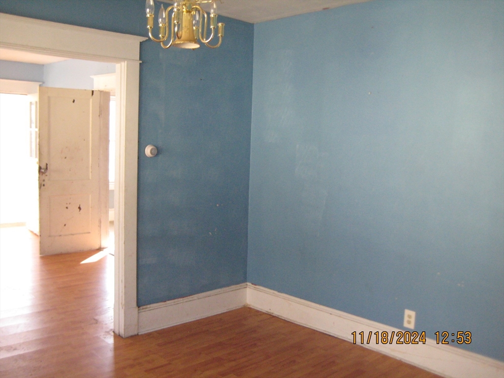 46-48 Wait Street Springfield, MA 01104 - Photo 15 of 19 a view of a hallway with wooden floor