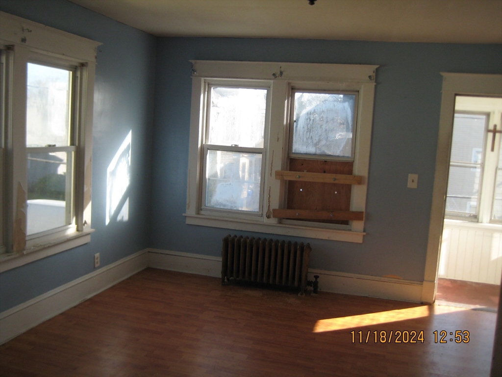 46-48 Wait Street Springfield, MA 01104 - Photo 17 of 19 an empty room with wooden floor and windows