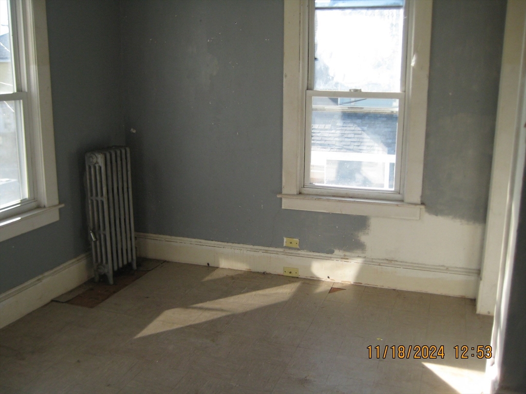 46-48 Wait Street Springfield, MA 01104 - Photo 18 of 19 a view of an empty room with a window