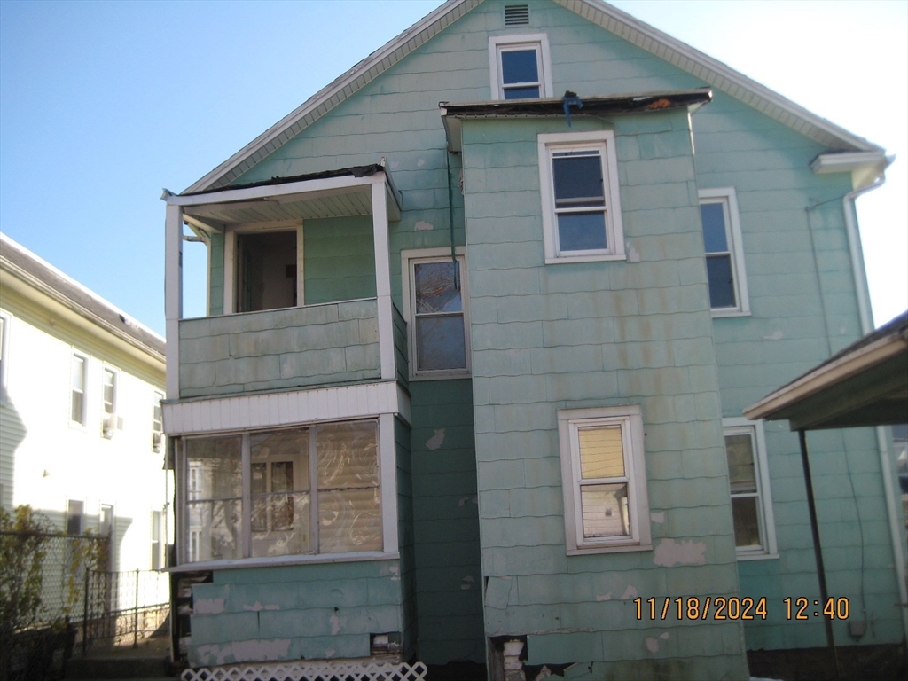46-48 Wait Street Springfield, MA 01104 - Photo 2 of 19 a front view of a house with a garden