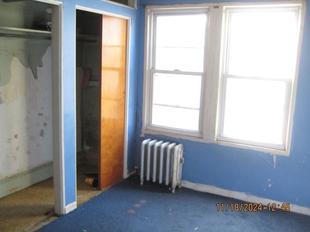 46-48 Wait Street Springfield, MA 01104 - Photo 3 of 19 a view of an empty room and window