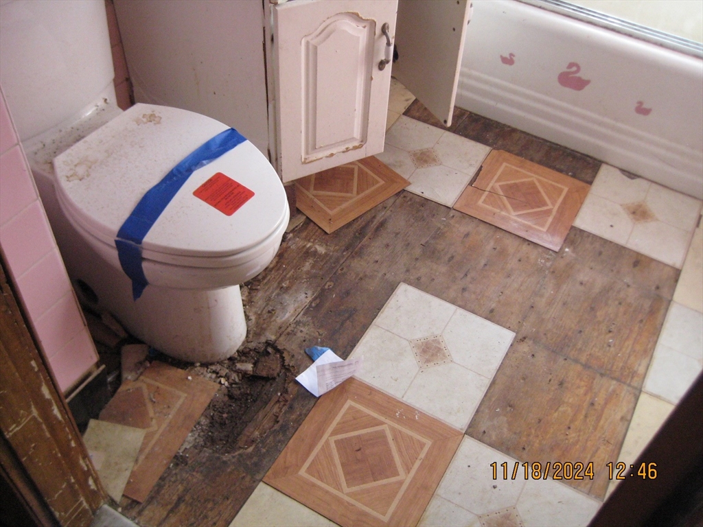 46-48 Wait Street Springfield, MA 01104 - Photo 5 of 19 a bathroom with a sink and a mirror