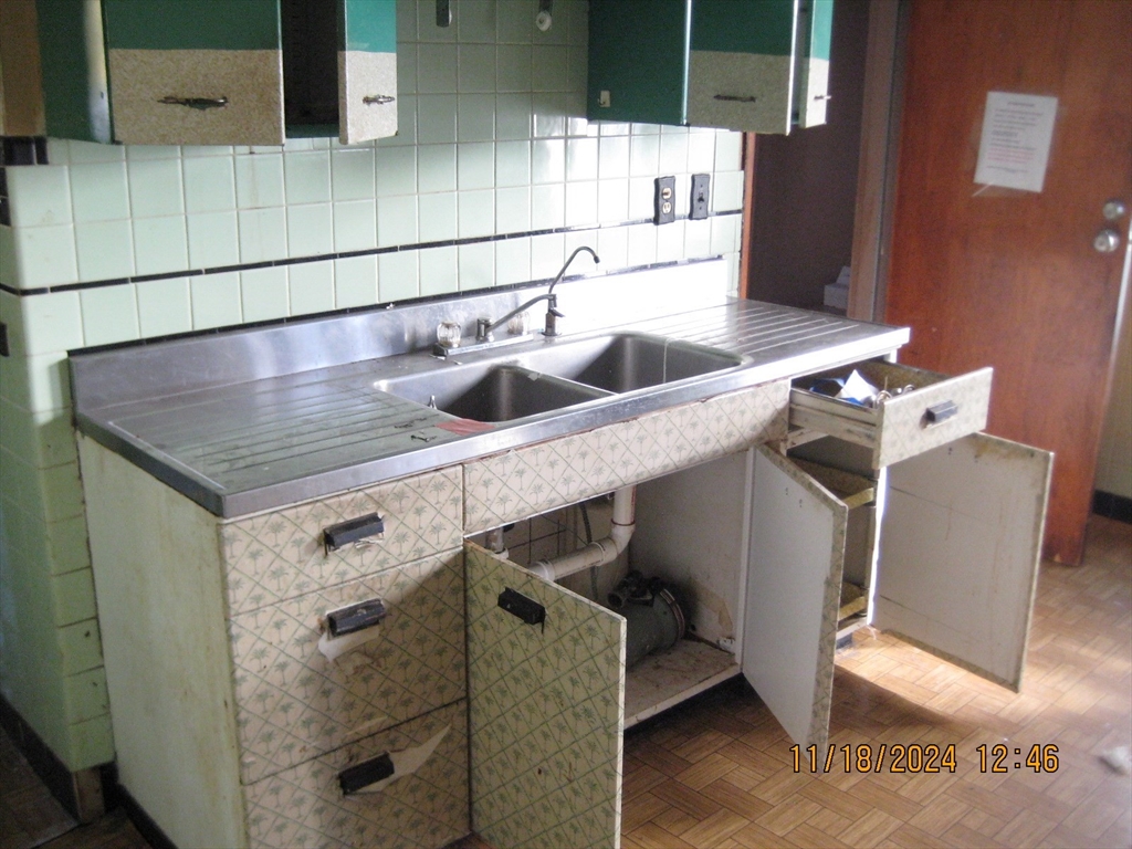 46-48 Wait Street Springfield, MA 01104 - Photo 7 of 19 a bathroom with a sink and mirror