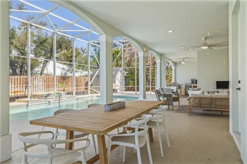a dining room with furniture and wooden floor