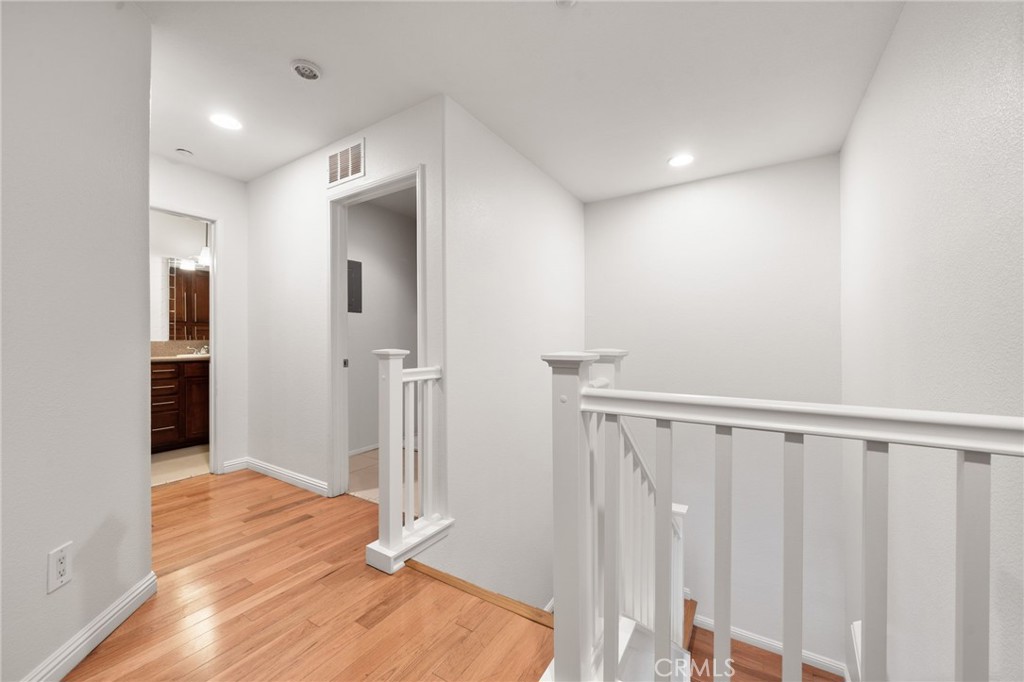 7331 Shelby Place, Unit 102 Rancho Cucamonga, CA 91739 - Photo 18 of 44 a view of entryway with wooden floor