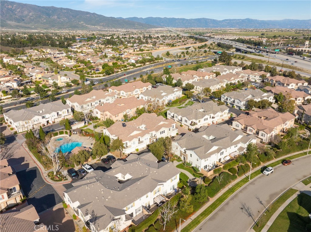 7331 Shelby Place, Unit 102 Rancho Cucamonga, CA 91739 - Photo 43 of 44 an aerial view of residential houses with outdoor space and swimming pool