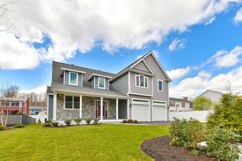 a front view of a house with a yard
